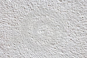 Fragment of natural white stone surface background texture.