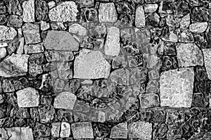 Fragment of old brick wall with river stones texture white grey brown black green blue lime yellow orange maroon violet pink turqu