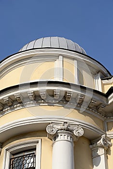 Fragment of an old building in the classical style in the center of St. Petersburg.