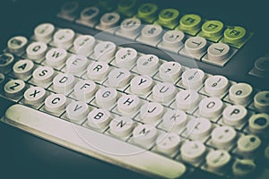 Fragment of an old computer keyboard with round buttons, close-up