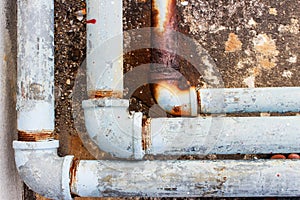 A fragment of the old conduit and Joint pipes corrode.