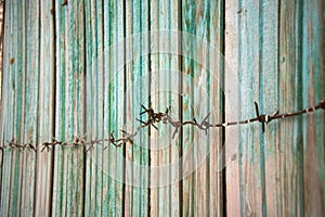 Fragment old green wooden fence. Wooden texture. Texture, background.Old wood painted surface