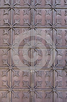 Fragment of an old iron door as a structural background.