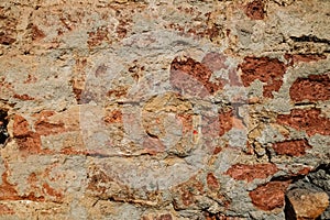 Fragment of an old red brick wall. Texture, background.