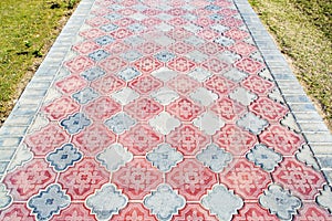 Fragment of old stone and tile pavement surface texture