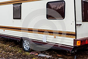 Fragment of an old trailer, a mobile home. Space for lettering or design