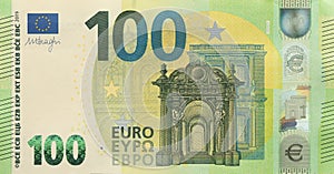 Fragment of one hundred euro money bill. Details of European union currency banknote of 100 euro