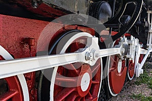 Fragment of outgoing locomotive on rails close-up from below