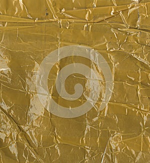 The fragment packing postage. brown paper completely glued with yellow tape. photo