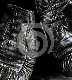 Fragment of a pair of old leather boxing gloves