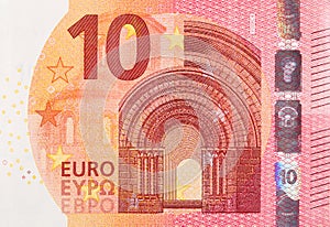 Fragment part of 10 euro banknote close-up with small red details