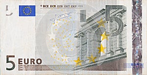 Fragment part of 5 euro banknote close-up with small brown details