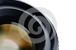 Fragment of a portrait lens for a modern SLR camera. A photograph of a wide-aperture lens with a focal length of 50mm isolated on