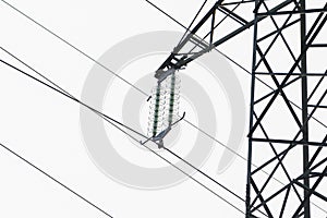 A fragment of a power line. Concept: transmission of electricity, power grids and electrical substations.