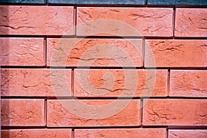 Fragment of red brickwork. Part of a brown brick wall