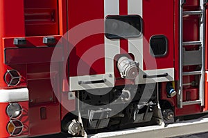 Fragment of a red fire engine. Fire technological transport. Fire engines are preparing for fire fighting