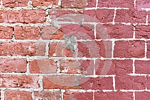 Fragment of the restoration of the old red brick wall