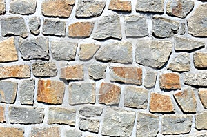 Fragment of rough stone wall