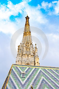 Fragment of Saint Stephen`s Cathedral Stephansdom. Colorful roof and tower. Wien. Vienna. Austria.