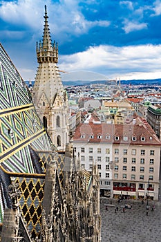 Fragment of Saint Stephen`s Cathedral Stephansdom. Colorful roof and tower. Wien. Vienna. Austria.