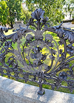 Fragment of a shod fencing around a monument to Adam Mickiewicz. Warsaw, Poland