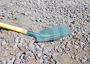 Fragment of shovel with wooden handle and metal blade and shank