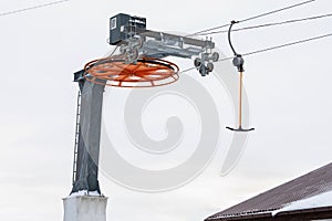 Fragment of a ski lift against the sky