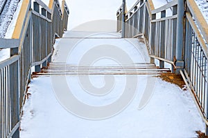 Fragment of a snow covered flight of stairs leading down