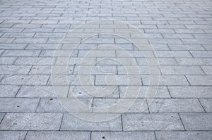 Fragment of the square paved of a large granite tiles