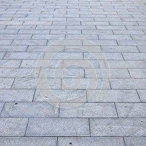 Fragment of the square paved of a large granite tiles