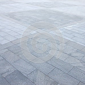 Fragment of the square paved of a large granite tiles