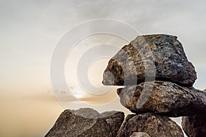 Fragment of stone megalith at sunset