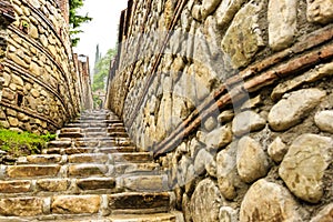 Fragment of stone stairs and stone arch after rain. The Monastery of St. Nino at Bodbe, Georgia