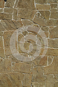 Fragment of the stone wall with a flat pattern