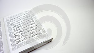 fragment of surah al-quran, al-kahf, selected focus  on white background