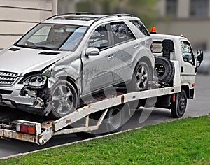 Fragment of tow truck which is taking away faulty car