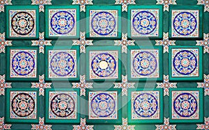 A fragment of the traditional pattern on the ceiling of the Long Corridor of the most interesting sights of the Summer Palace in B