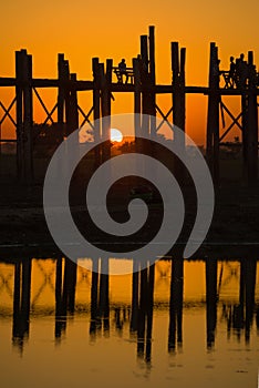 Fragment of the U Bein Bridge on a sunset background. Amarapura