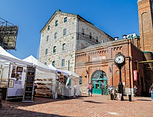 Fragment of view of Toronto distillery historic district square on art fest sunny day
