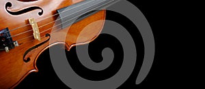 Fragment of a violin on a black background. Concert poster for classical music. Music concept. copy spaces