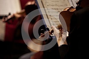 Fragment of a violin in the hands of a musician