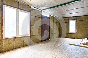 Fragment of the wall of the interior of a country house, the wall is thermally insulated with mineral plates