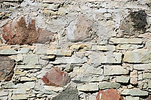 Fragment of wall made of rough uneven stones