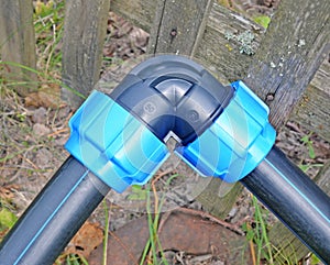 Fragment of water supply system. Angular plastic fitting