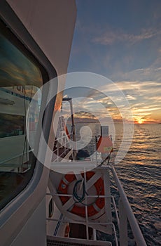 Fragment wheelhouse of the ship on a background of sea sunset.