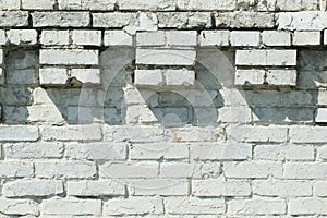 Fragment of a white brick wall