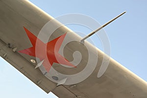 Fragment of a wing of the Soviet military plane amphibian against the blue sk