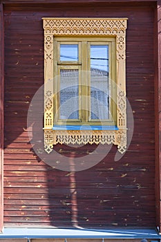 Fragment of a wooden house with carved platbands in Gorodets, Russia