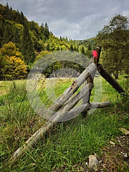 Fragment of a wooden mountain fence