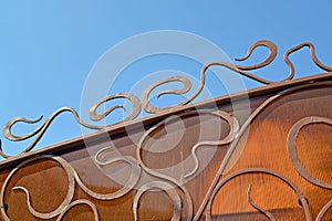 Fragment of a wrought iron gate with an element of Art Nouveau `Blow of a scourge Blow of a whip